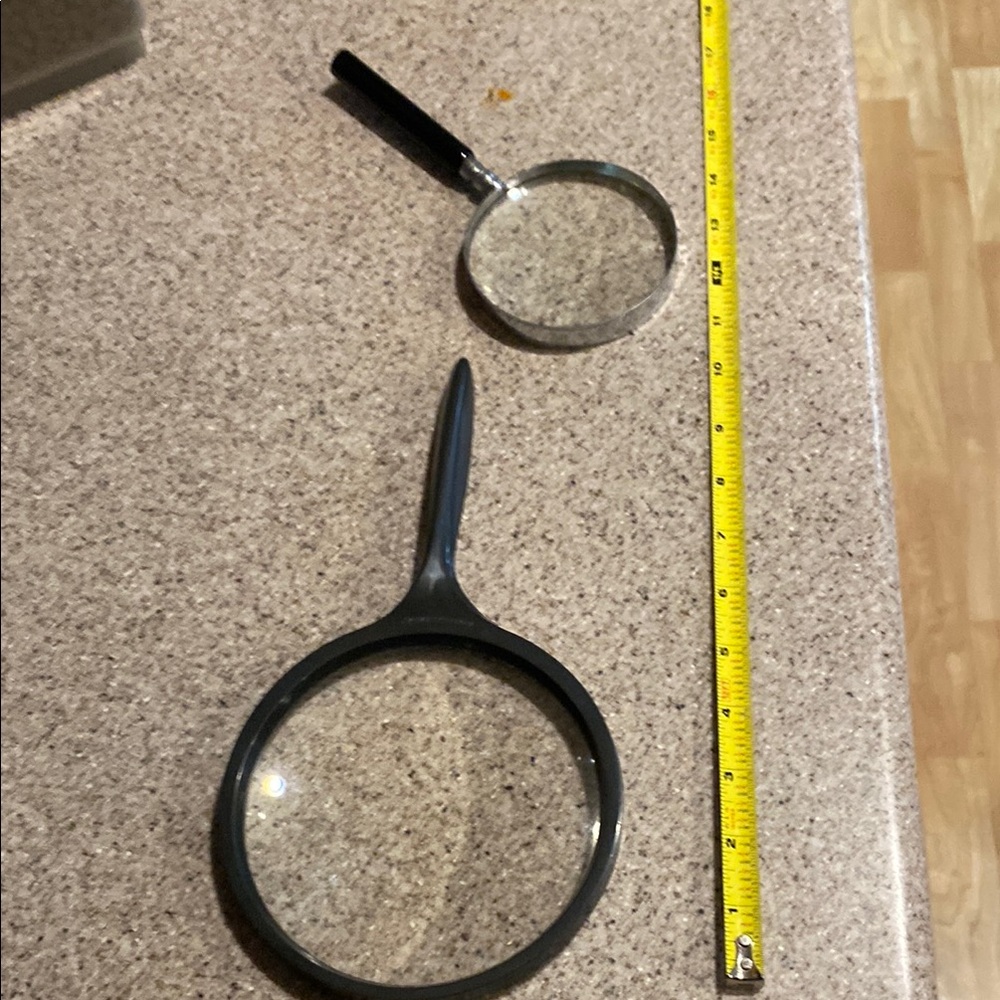Two Magnifying Glasses - the larger one is Bausch and Lomb